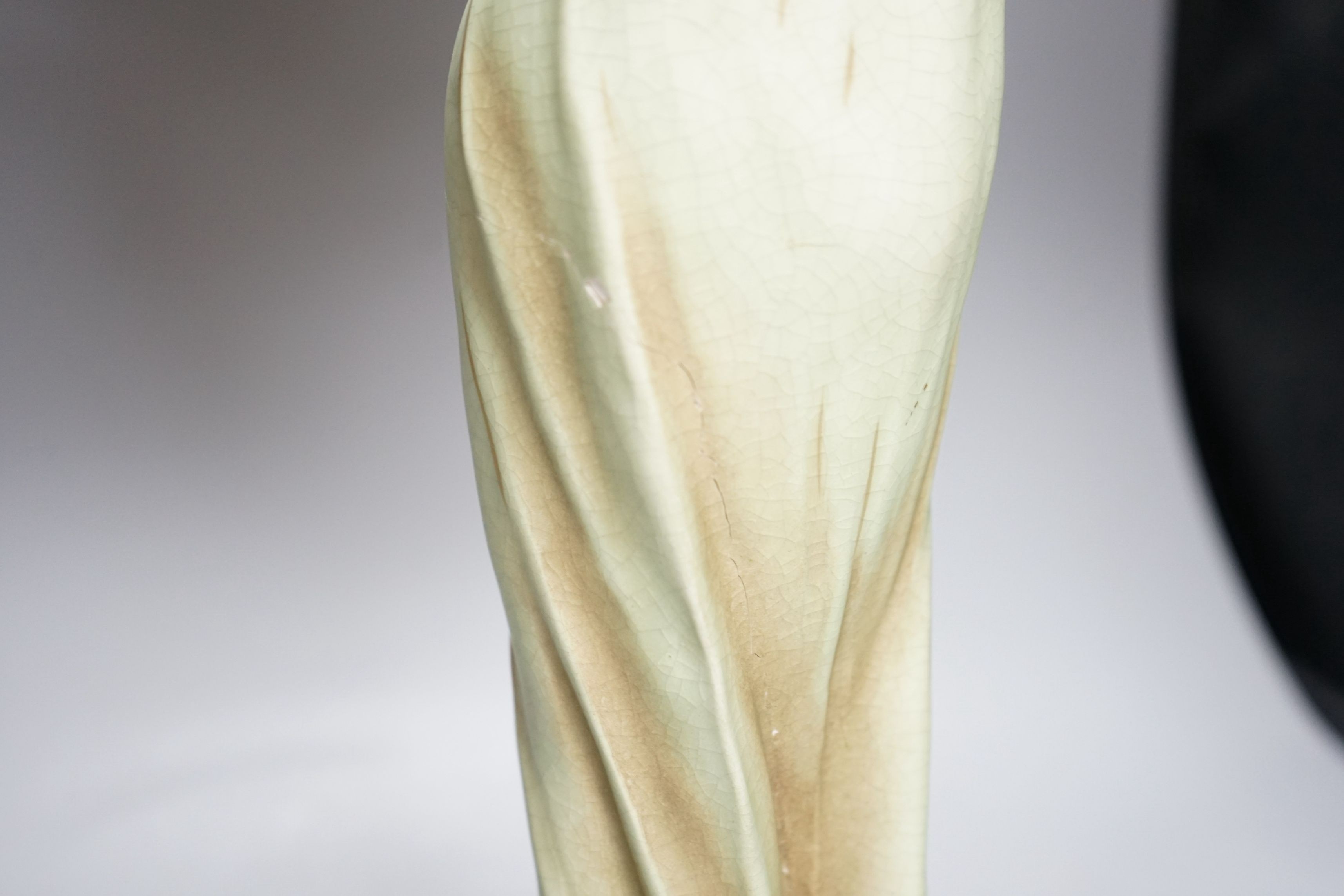 A continental Art Nouveau ceramic figure of a lady holding a mirror, 57cms high not including mirror